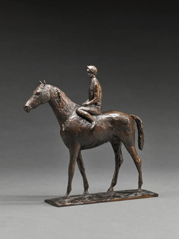 A bronze sculpture of a horse and jockey